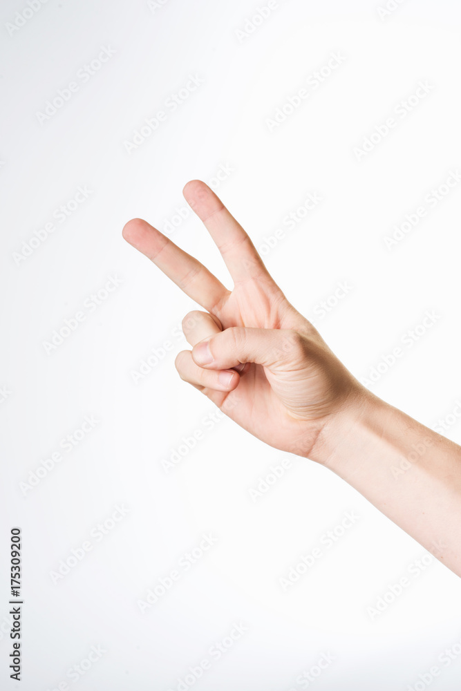 Hand showing the sign of victory and peace Hand showing the sign of victory and peace