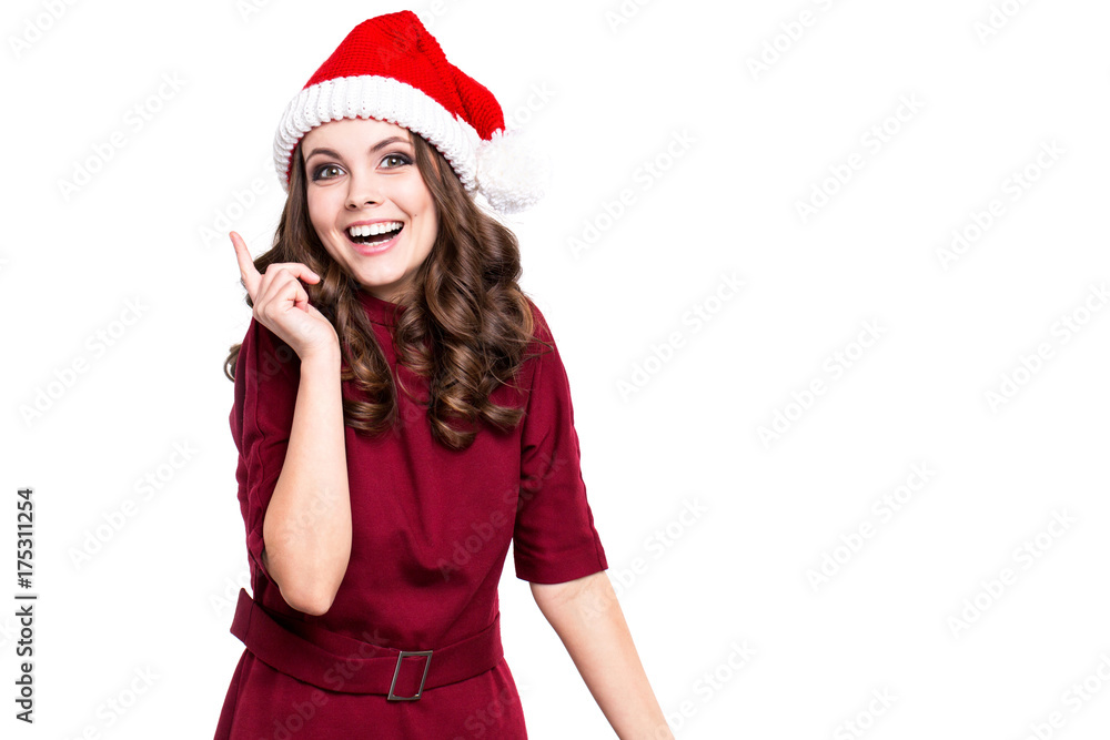 Portrait of a cheerful happy woman in santa hat and red dress. Portrait of a cheerful happy woman in santa hat and red dress.