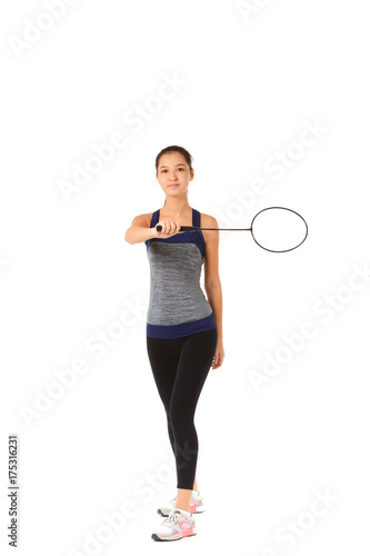 Beautiful Asian woman holding a badminton racket isolated on white background © fotofabrika