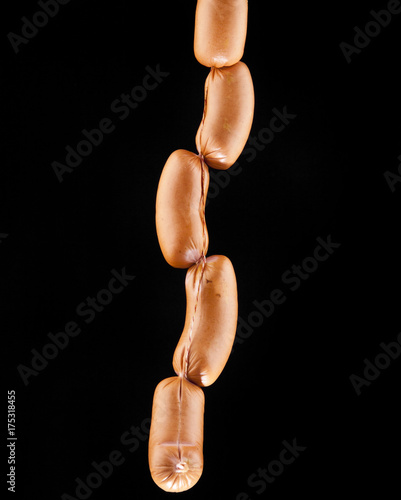 Sausages on a black background