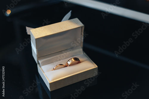 gold wedding rings in a paper box
