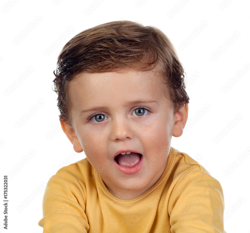 Adorable small child showing his tongue