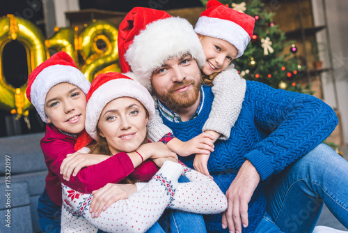 family in santa hats