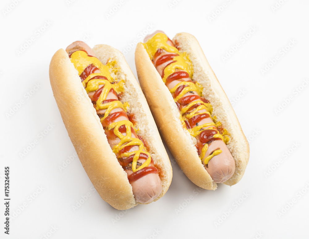 Two hotdogs with ketchup and mustard on white background. Isolated. Food. Two hotdogs with ketchup and mustard on white background. Isolated. Food.