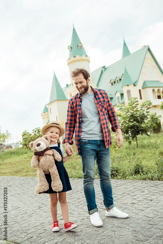Obraz premium family walking in park