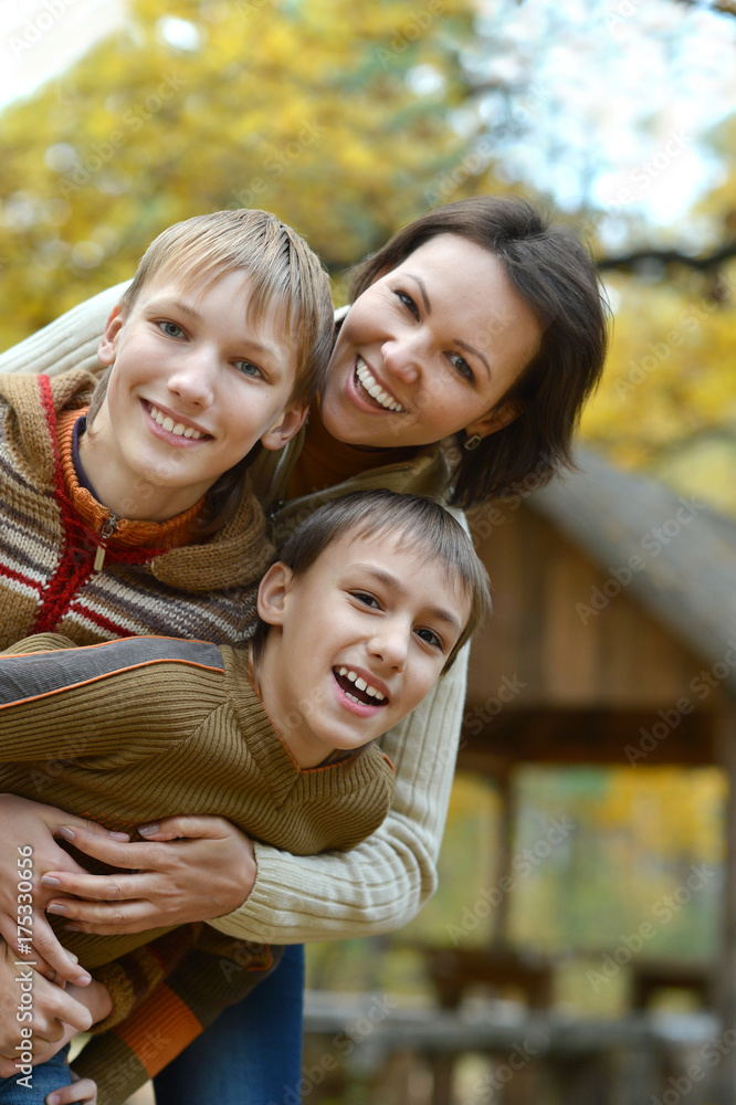 Happy family in autumn forest Happy family in autumn forest