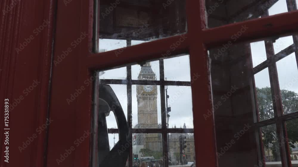 Red telephone booth and Big Ben tower. Red telephone booth and Big Ben tower.