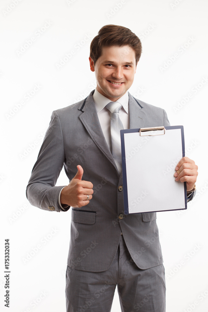 Young businessman showing blank clipboard, isolated on white background. Success in business, job and education concept shot Young businessman showing blank clipboard, isolated on white background. Success in business, job and education concept shot