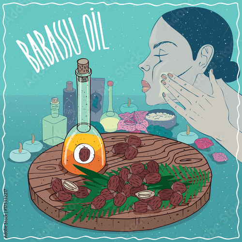 Glass Decanter of Babassu oil and seeds of Attalea speciosa plant. Girl applying facial mask on face. Natural vegetable oil used for skin care