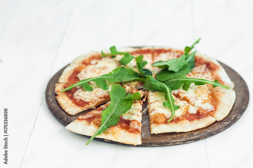 Pizza margarita with arugula
