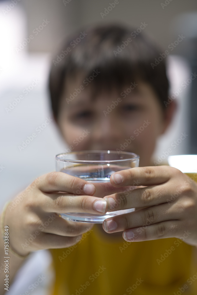 Child drinking a glass of pure water Child drinking a glass of pure water