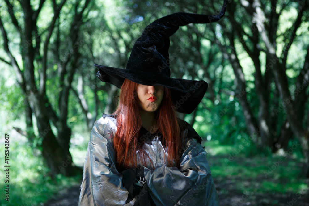 Image of dissatisfied witch in long black hat Image of dissatisfied witch in long black hat