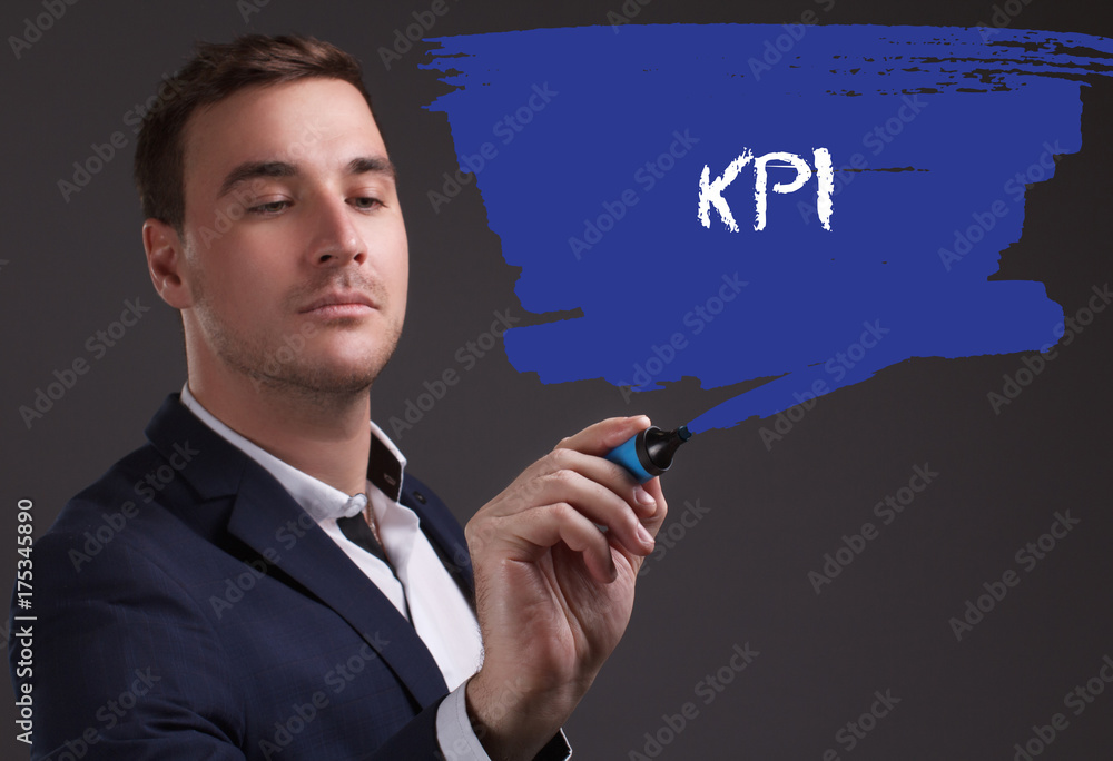 The concept of business, technology, the Internet and the network. Young businessman showing inscription: KPI The concept of business, technology, the Internet and the network. Young businessman showing inscription: KPI