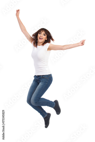 Jumping Young Woman With Arms Outstretched
