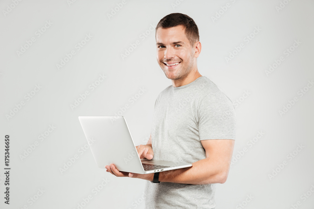 Happy man chatting by laptop computer. Happy man chatting by laptop computer.