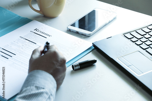 businessman Reading application form resume paper In the office