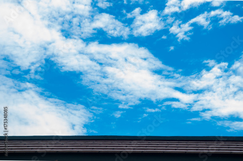 Brown roofing and blue sky