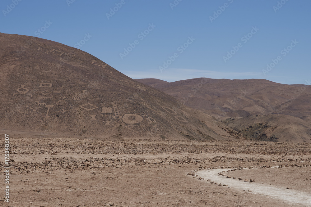 Large group of ancient petroglyphs on the hillsides at Cerro Pintados in the Atacama Desert in the Tarapaca Region of northern Chile. Large group of ancient petroglyphs on the hillsides at Cerro Pintados in the Atacama Desert in the Tarapaca Region of northern Chile.