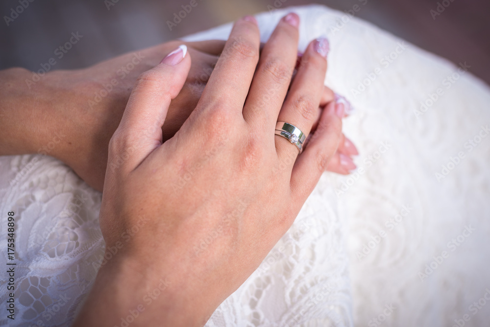 the bride's hand with the ring the bride's hand with the ring