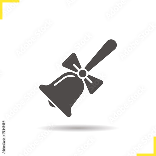 School bell with bow glyph icon