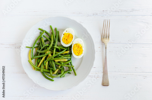 Cooked green beans with boiled eggs