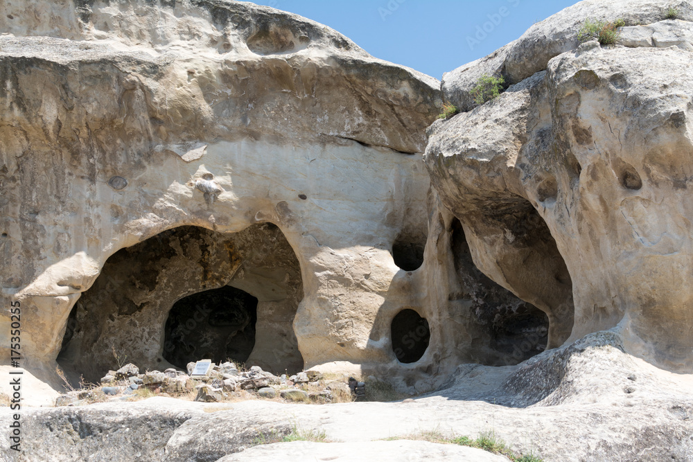 Rooms of ancient people houses, hewn in rocks. Uplistsikhe, the famous Georgian underground city Rooms of ancient people houses, hewn in rocks. Uplistsikhe, the famous Georgian underground city