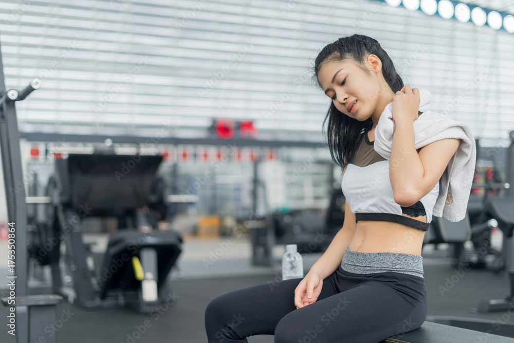 Fitness woman relax after exercises in gym Fitness woman relax after exercises in gym