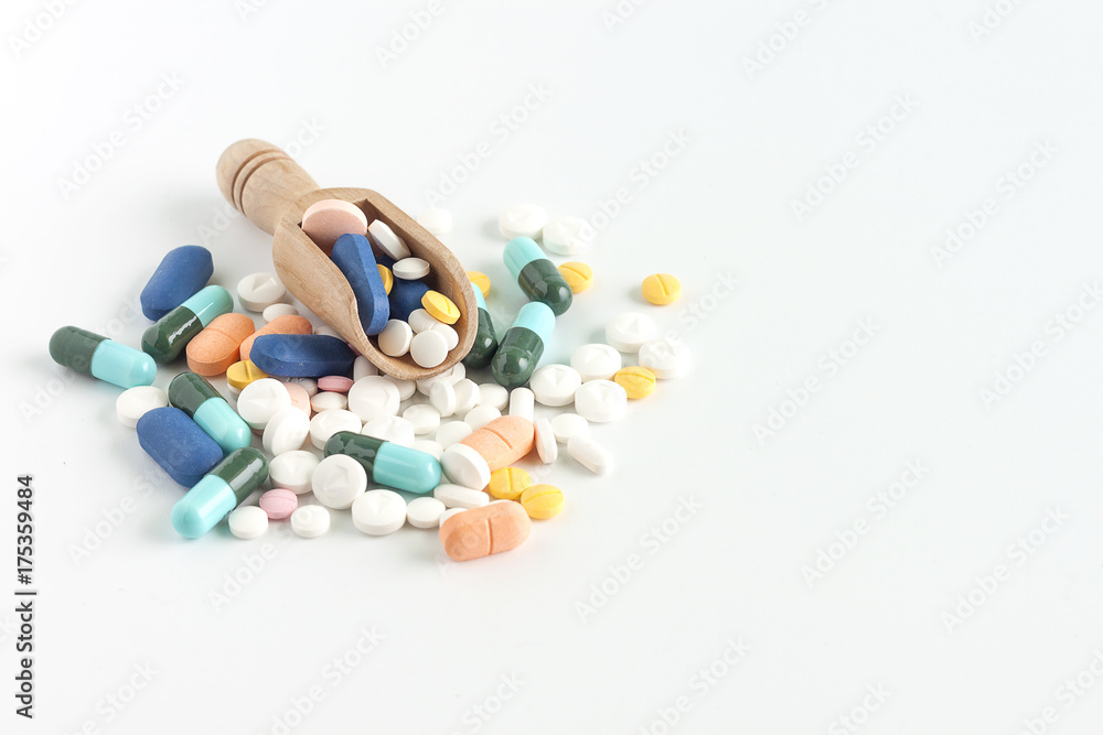 Colorful medicine on wooden spoon Colorful medicine on wooden spoon