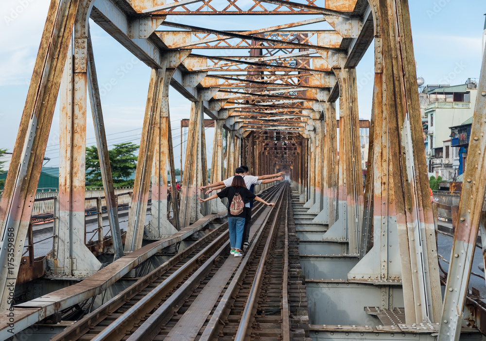 Young group enjoy running on railway track Young group enjoy running on railway track