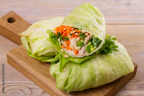 Lettuce wraps with chicken, carrot, peanuts and ginger-scallion oil, horizontal