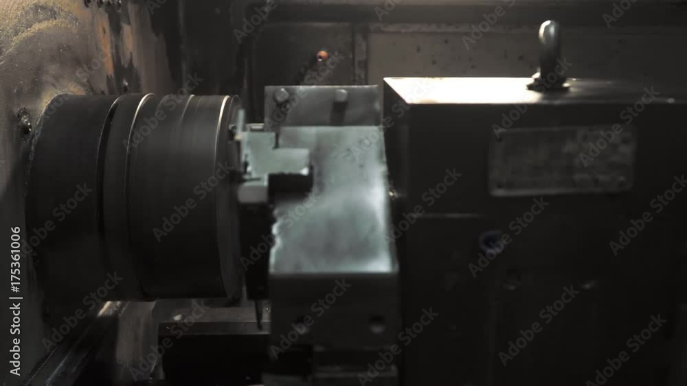 the CNC machine making the part from metal the CNC machine making the part from metal