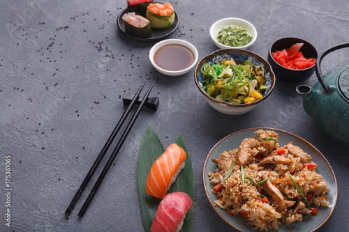 Served table with asian food background