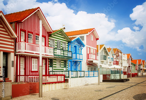 street with typical striped houses Costa Nova, Aveiro, Portugal, retro toned photo