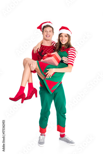 man holding girlfriend with present