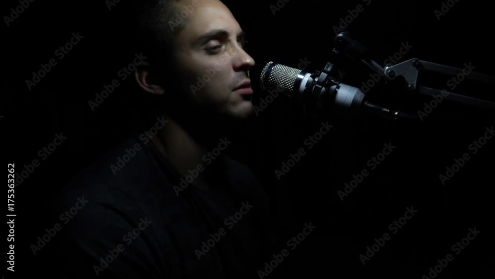 Man singing In Recording Studio with microphone Man singing In Recording Studio with microphone