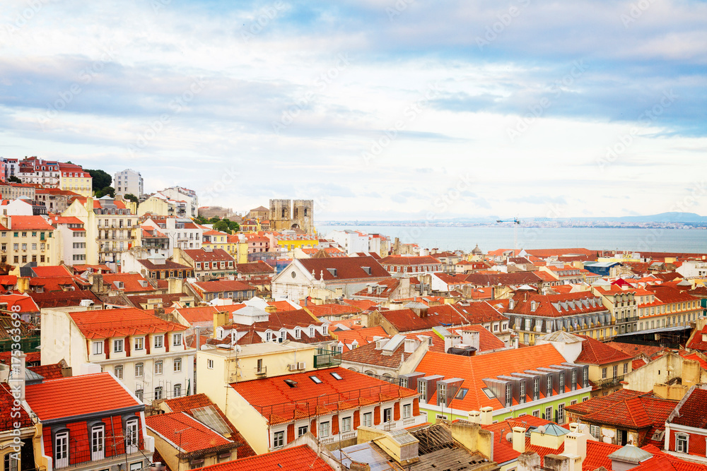 skyline of Lisbon over old town quarters with Se cathedral, Portugal, retro toned