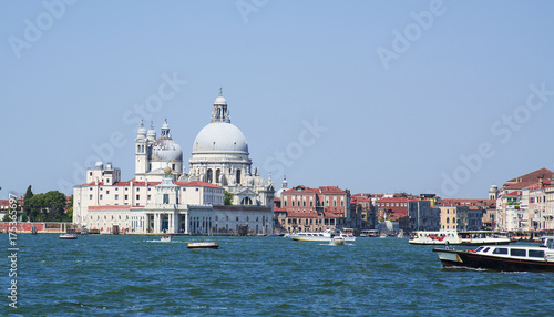 Grand Canal and Basilica Santa Maria della Salute in Venice on a bright day. © Ms VectorPlus