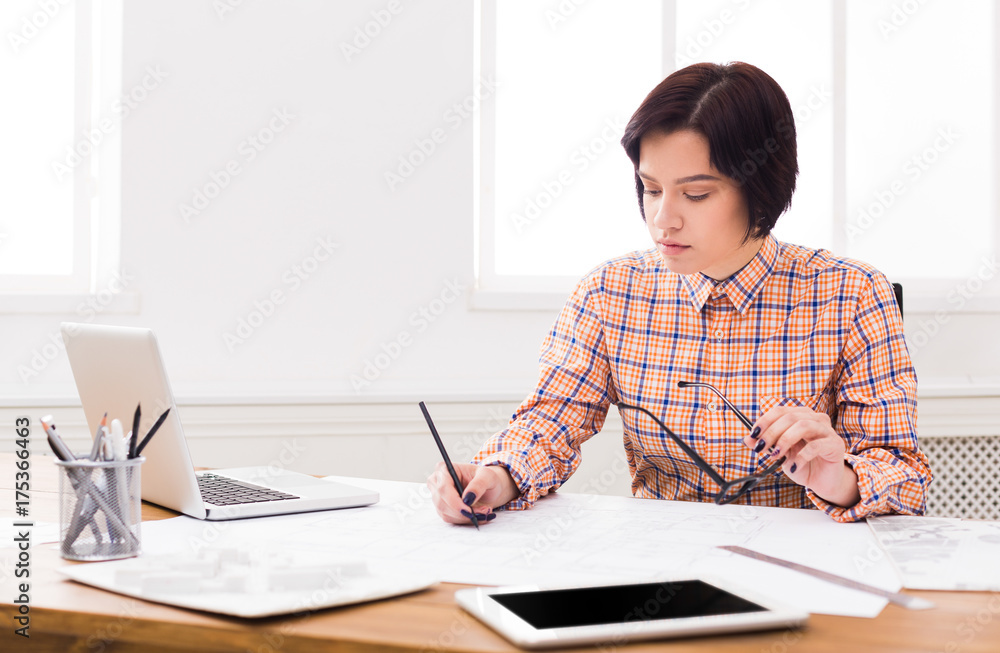 Business woman reading document at office desktop Business woman reading document at office desktop