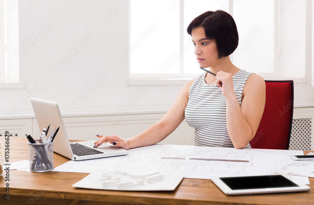 Business woman working on laptop at office Business woman working on laptop at office