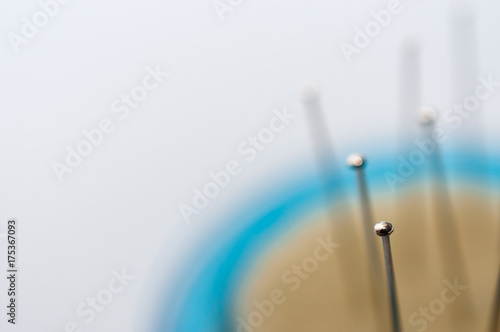 Pin on focus, isolated on white.