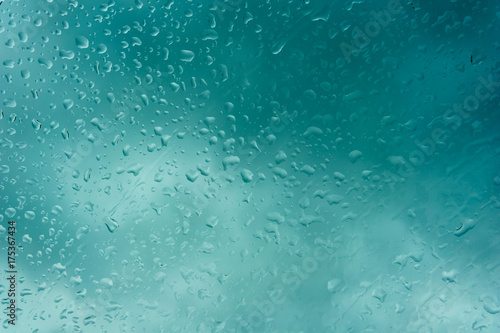 beautiful drop of rain on glass or windows surface. dew or raindrop on glass surface for abstract background