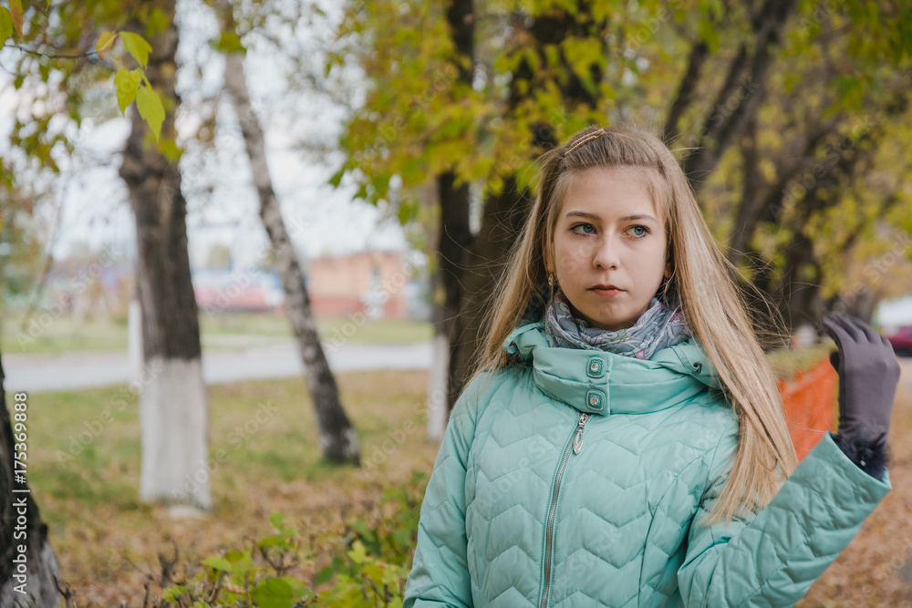 The girl walks in the park in the fall. Autumn wood. Walk in the fall on the wood. The girl walks in the park in the fall. Autumn wood. Walk in the fall on the wood.