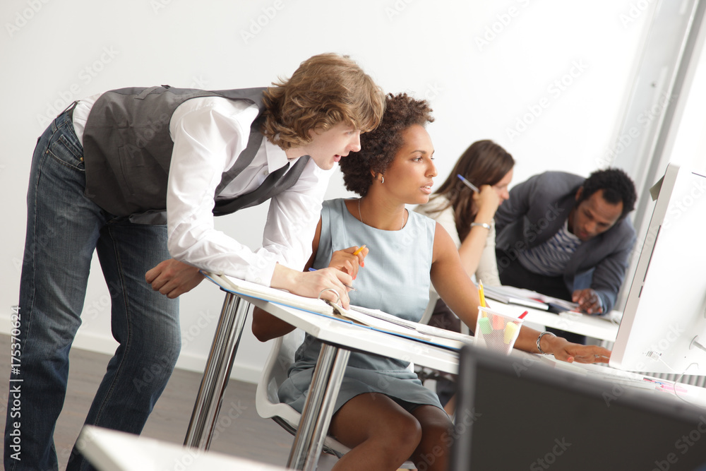 Fototapeta premium Young Start-up Professionals Serie: At work in A new Bright Office Space
