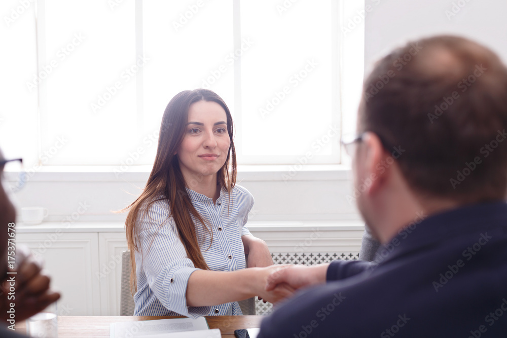Business meeting. Managers handshaking after meeting. Closeup Business meeting. Managers handshaking after meeting. Closeup