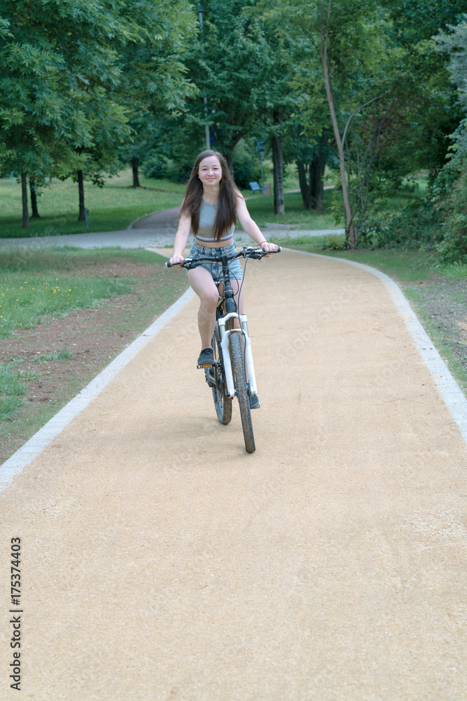 Girl teenager on a bicycle Girl teenager on a bicycle