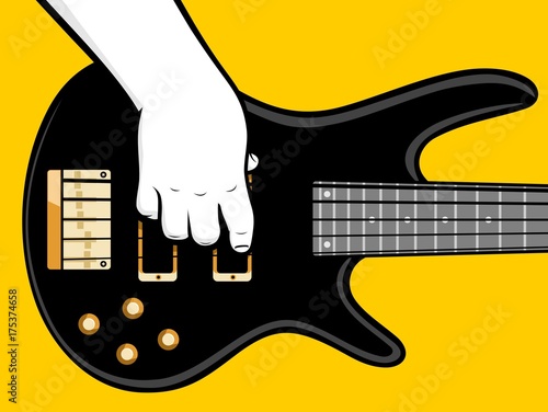 Close up hand playing bass