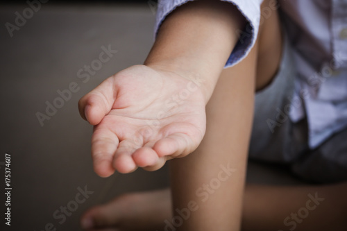 Child reaching out for help.