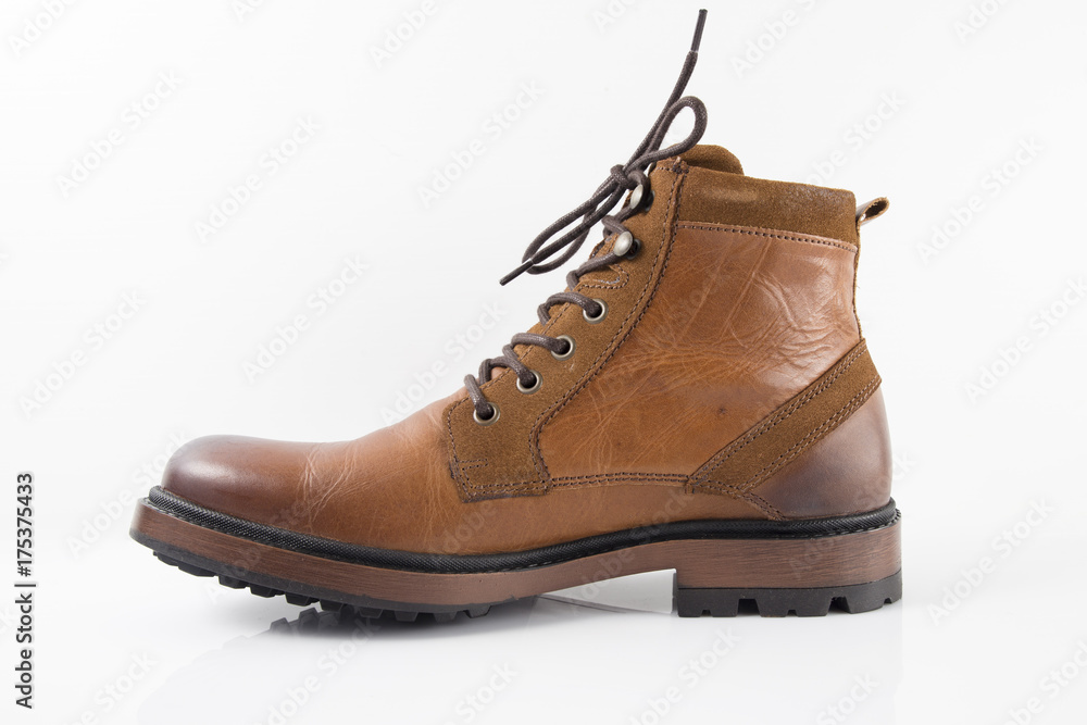 Male brown leather boot on white background, isolated product.