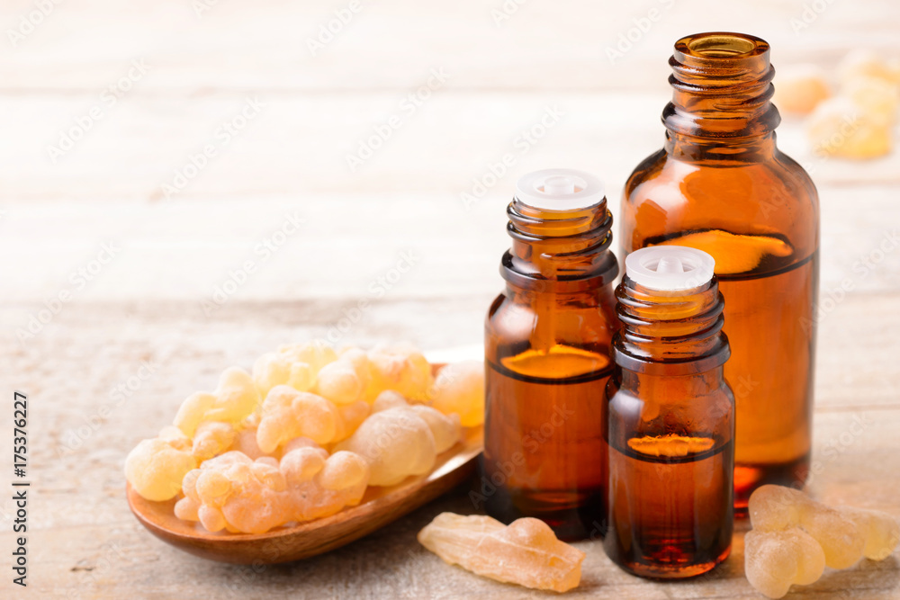 Frankincense essential oil and frankincense on the table Frankincense essential oil and frankincense on the table