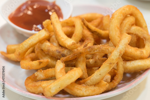 Homemade fast food portion of french fries with Tomato sauces